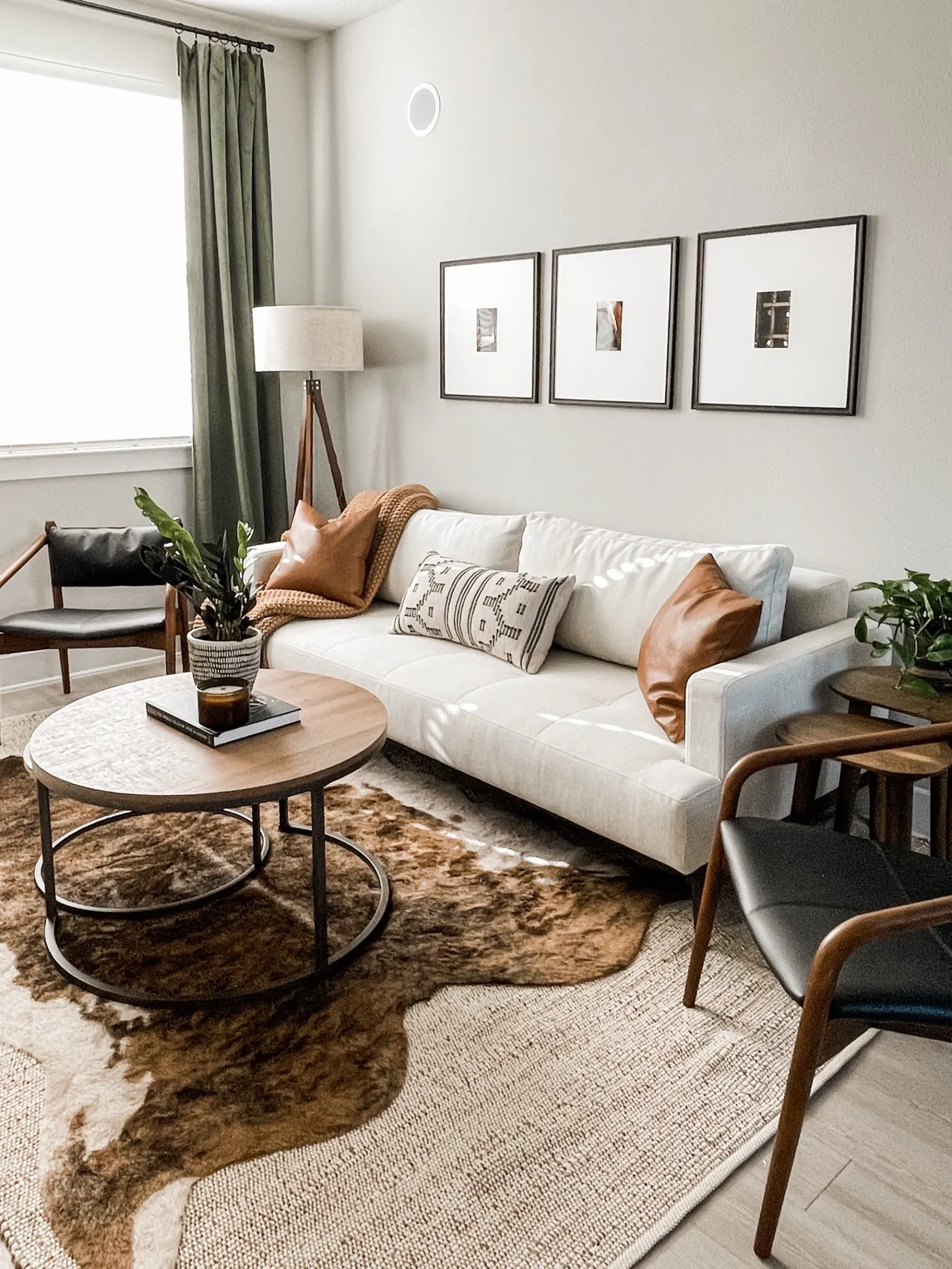 A furnished shared living room in a Myroomzie co-living home, with a sofa, armchairs, and coffee table