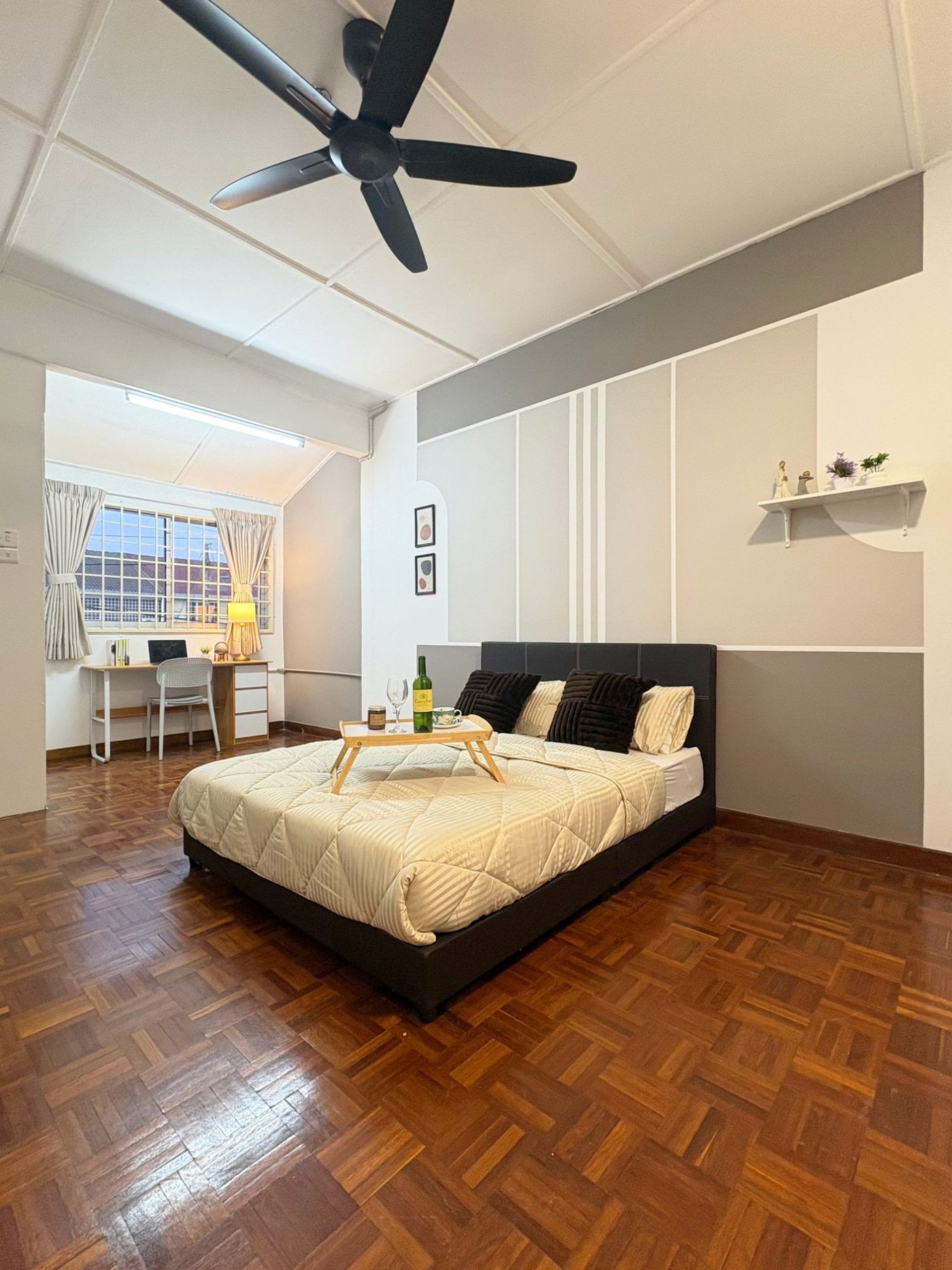 Master Room: a spacious furnished bedroom with a large bed and study area