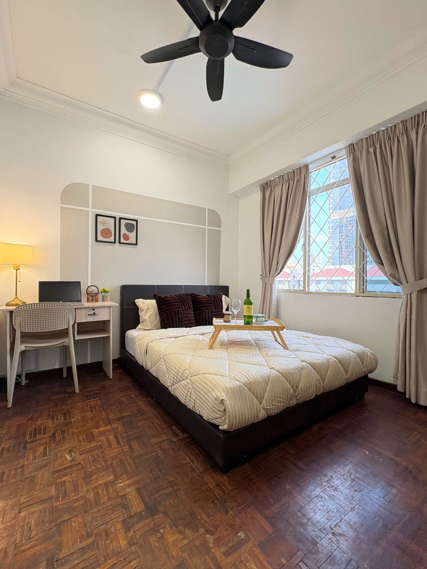 Middle Room: a furnished queen bed with a study desk and large window